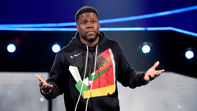 Kevin Hart speaking onstage