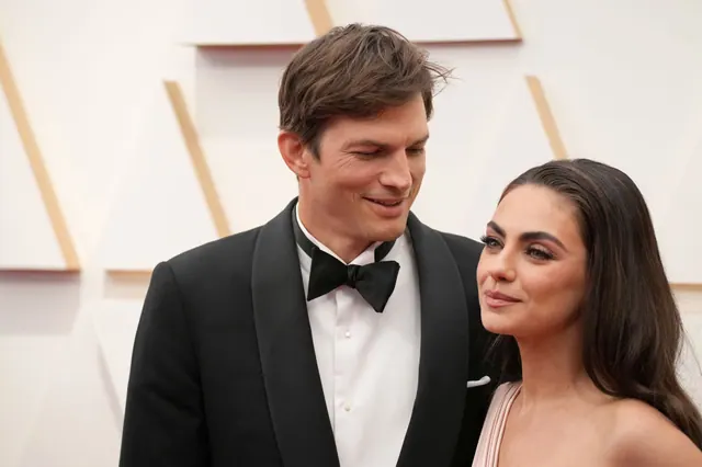 Mila Kunis and Ashton Kutcher at an archival public event, photographed by Jeff Kravitz.