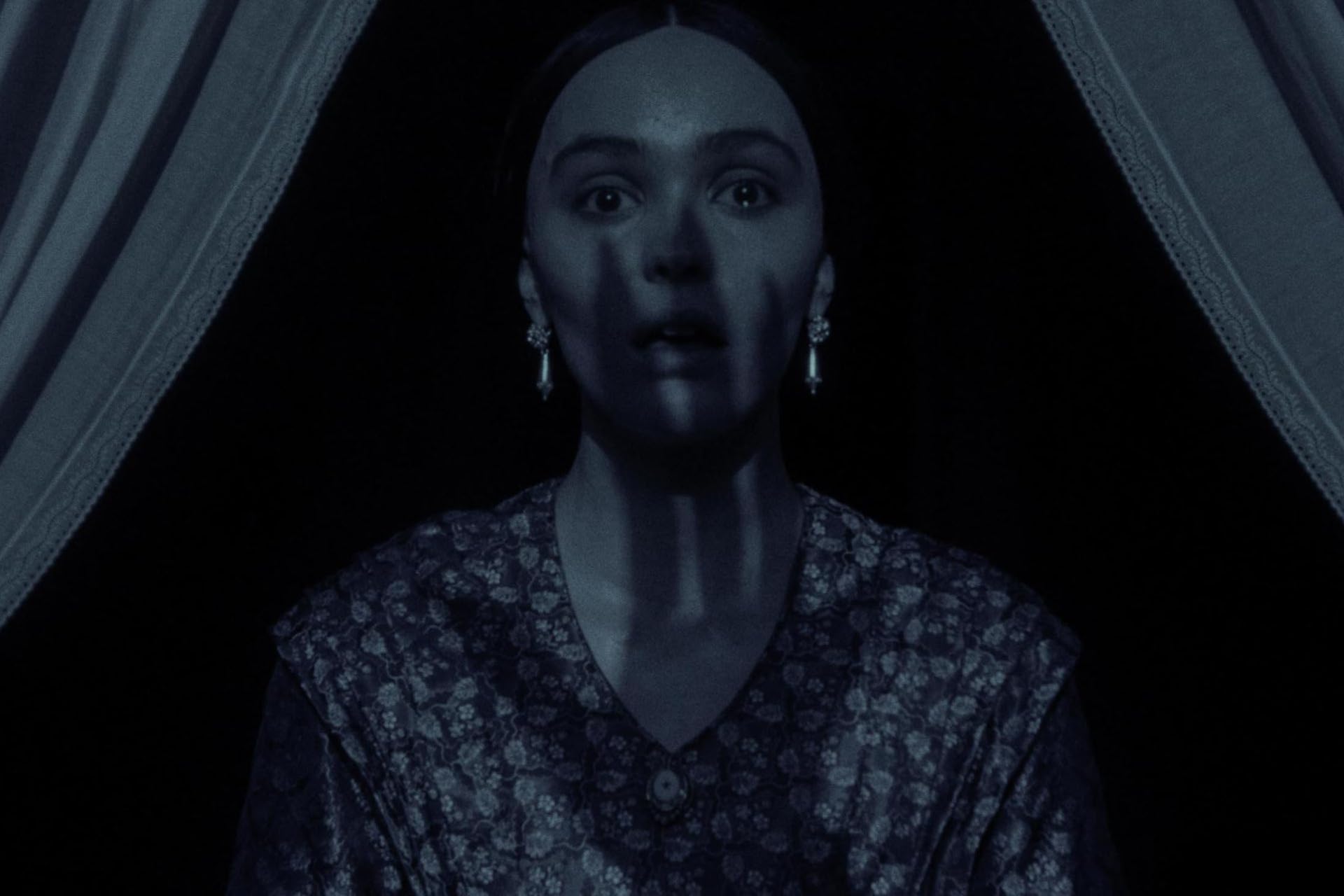 Lily-Rose Depp as Ellen Hutter in a dark scene from Nosferatu